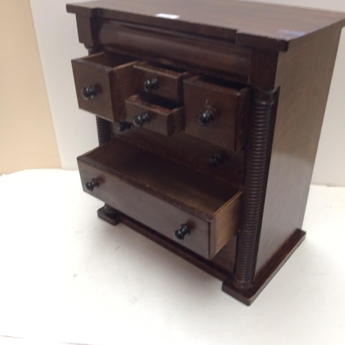 278 - A Scottish, oak Apprentice cabinet/specimen 7 drawer cabinet, and a quantity of cigarette cards