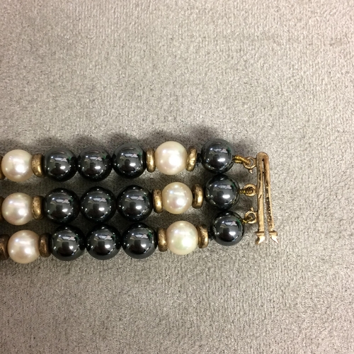 3 - Annabel Jones  triple stand pearl bracelet with alternate black and white cultured pearls with centr... 