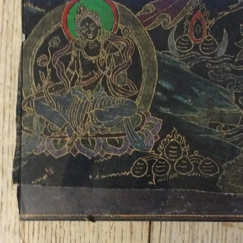 333 - Thangka Manjusri depicted as a male bodhisattva weilding a flaming sword in his right and hand seate... 