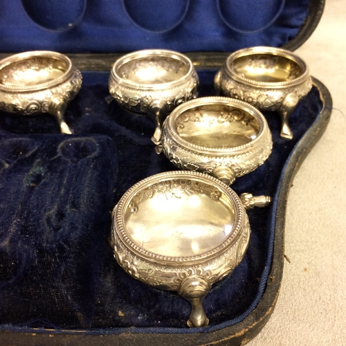 4 - Cased  set of 10 Victorian sterling silver salts, each with chased decoration and beaded rim raised ... 