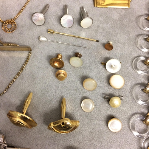 47 - Collection of unmarked yellow and white metal dress items to include cufflink tie clips, together wi... 