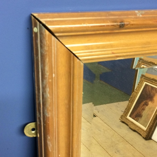 475 - A modern pine wall mirror,  and 2 chip board circular top tables