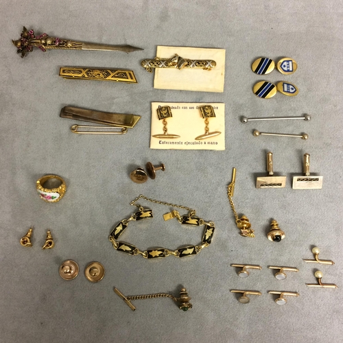 48 - Collection of unmarked yellow and white metal dress items to include cufflinks, dress studs, and oth... 