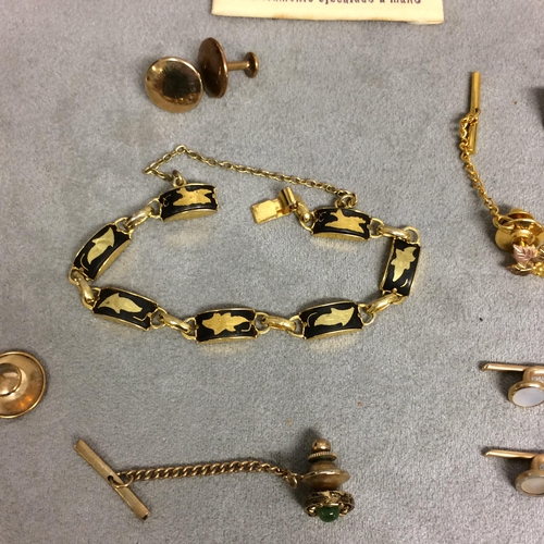 48 - Collection of unmarked yellow and white metal dress items to include cufflinks, dress studs, and oth... 