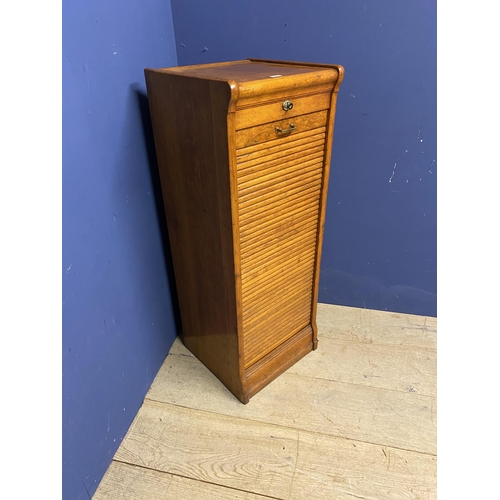 498 - A vintage honey coloured oak tambour fronted cabinet