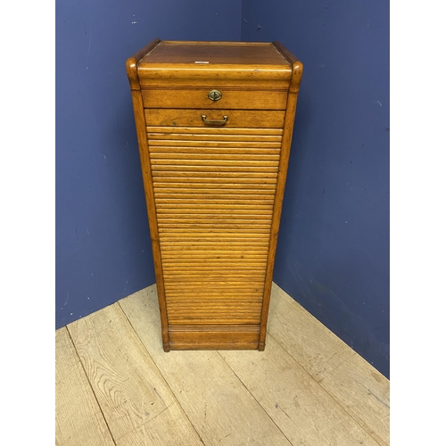 498 - A vintage honey coloured oak tambour fronted cabinet