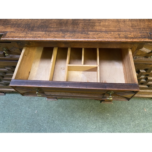 504 - C17th style oak breakfront dresser, with geometric carved panel cupboard doors,  together with oak d... 