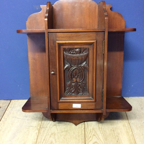 505 - Mahogany hanging cupboard, with raised carved floral panel to front