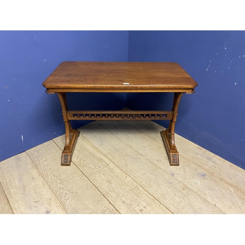 507 - Light honey coloured oak table, with galleried central stretcher and ecclesiastical carvings to each... 