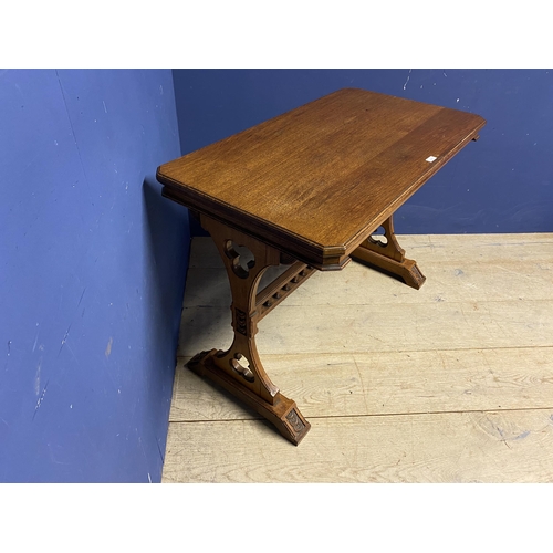 507 - Light honey coloured oak table, with galleried central stretcher and ecclesiastical carvings to each... 