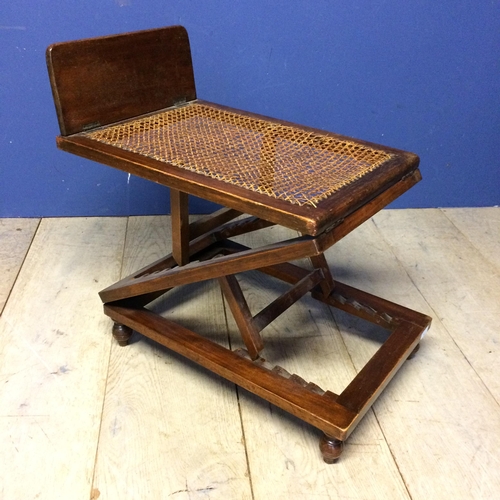 517 - Edwardian mahogany metamorphic stool with bergère to top (some areas of caning in need of repair)