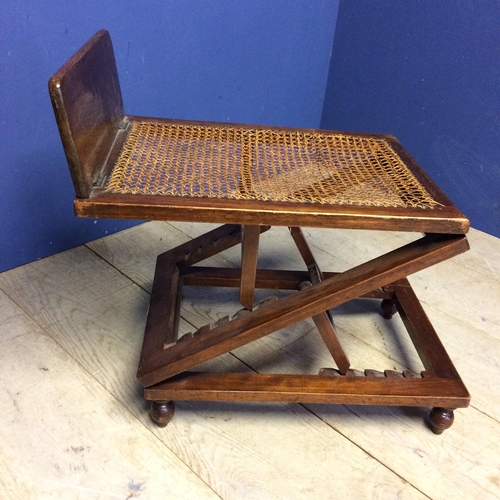 517 - Edwardian mahogany metamorphic stool with bergère to top (some areas of caning in need of repair)