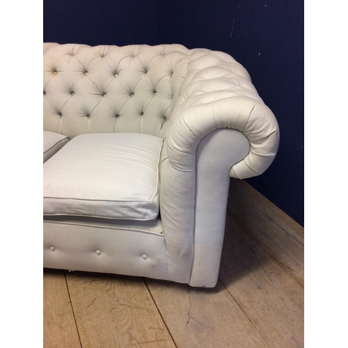 518 - Victorian chesterfield sofa, upholstered in a light coloured fabric (some areas grubby with marks, i... 