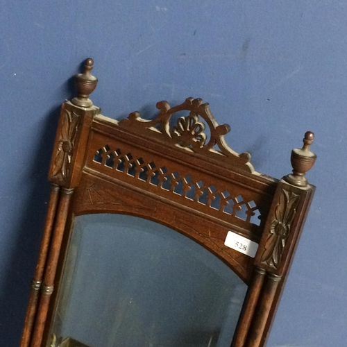 528 - Mahogany hanging wall mirror and shelf, with ornately carved fretwork design and finials