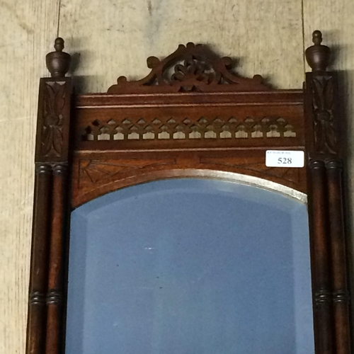 528 - Mahogany hanging wall mirror and shelf, with ornately carved fretwork design and finials