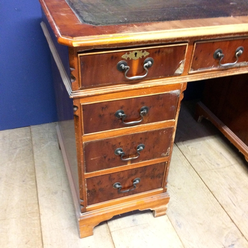 530 - 9 drawer bureau, with green leather top, in need of  attention, much wear 77h x 123w x 62d cm