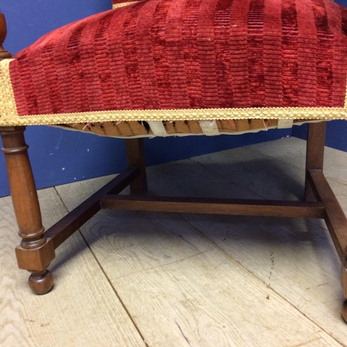 532 - Matching arm chair to the above lot 531; large oak framed arm chair with red upholstery