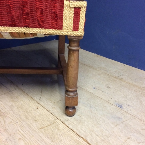 532 - Matching arm chair to the above lot 531; large oak framed arm chair with red upholstery