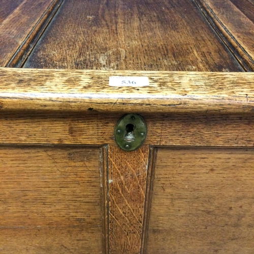 536 - Oak chest with rising 3 panelled lid, on 4 raised legs 59h x 100w x 47d cm, some wear to top