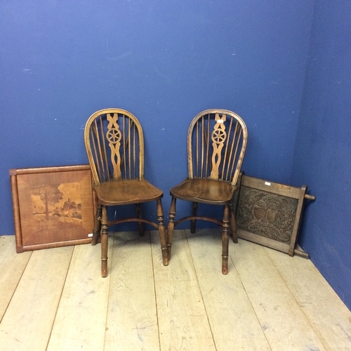 539 - Two elm stick back chairs, an carved oak panel, engraved crest inscribed with 