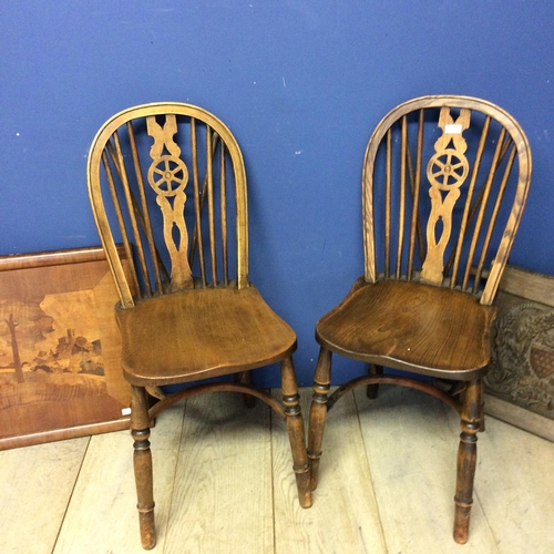 539 - Two elm stick back chairs, an carved oak panel, engraved crest inscribed with 