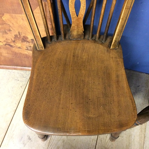 539 - Two elm stick back chairs, an carved oak panel, engraved crest inscribed with 