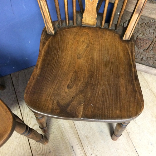 539 - Two elm stick back chairs, an carved oak panel, engraved crest inscribed with 