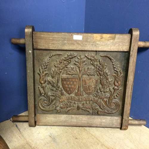 539 - Two elm stick back chairs, an carved oak panel, engraved crest inscribed with 