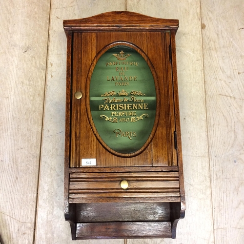 542 - An oak and glazed hanging wall cabinet, with drawer, the glass inscribed 