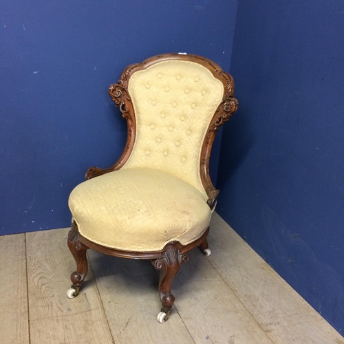 548 - Victorian yellow upholstered button back chair with cabriole legs to China castors