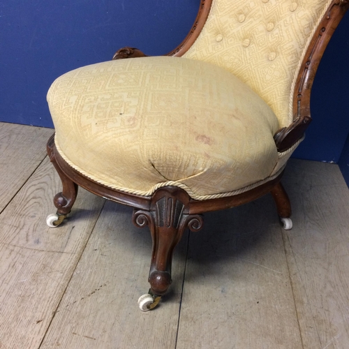 548 - Victorian yellow upholstered button back chair with cabriole legs to China castors