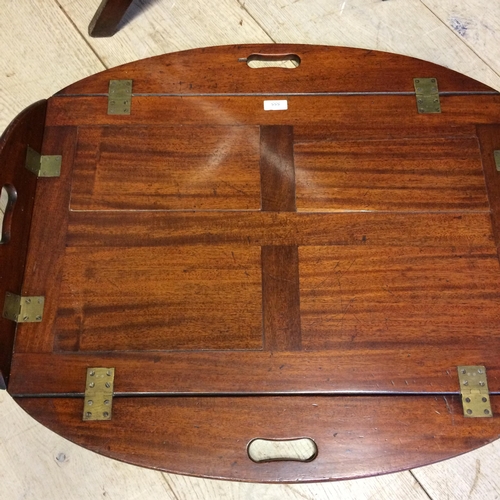 555 - Mahogany butlers tray, on folding stand, 66 x 89 x 77h cm