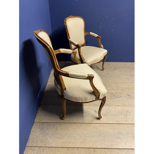 563 - Pair of French show frame style chairs, with cabriole legs, upholstered in a cream fabric, makers la... 