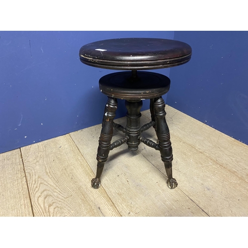 565 - Revolving piano stool, on unusual glass ball and claw feet, The Char and Parker company stamp to bas... 