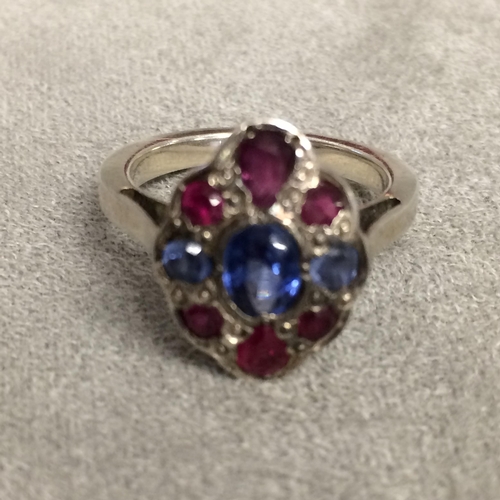 57 - 18ct white gold ruby & sapphire set flower ring in the manner of Sibyl Dunlop, 5.6g size N ( not hal... 