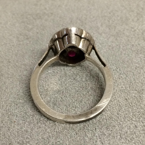 57 - 18ct white gold ruby & sapphire set flower ring in the manner of Sibyl Dunlop, 5.6g size N ( not hal... 