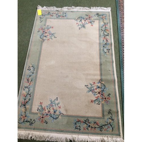 580 - Rugs: Chinese wash style rug with blue ground and pink and oakmeal boarders, and pink central medall... 