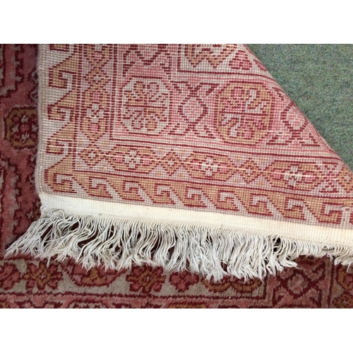 582 - Rugs: A Long red ground runner with all over geometric stylized patterns 72cm x 722cm