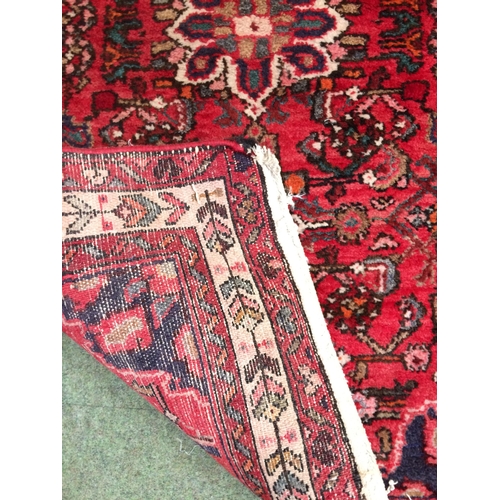 583 - 4 rugs, 3 red ground rugs with all over geometric stylized designs, and a blue and red ground Tree o... 