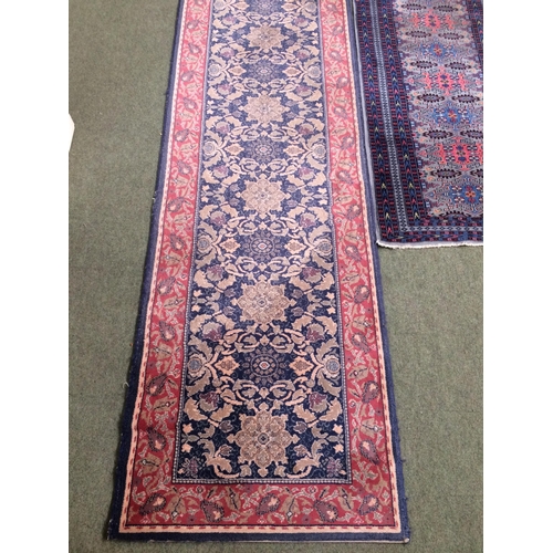 586 - 3 rugs:  a runner with red border and blue and floral central panel, and 2 smaller red and blue patt... 