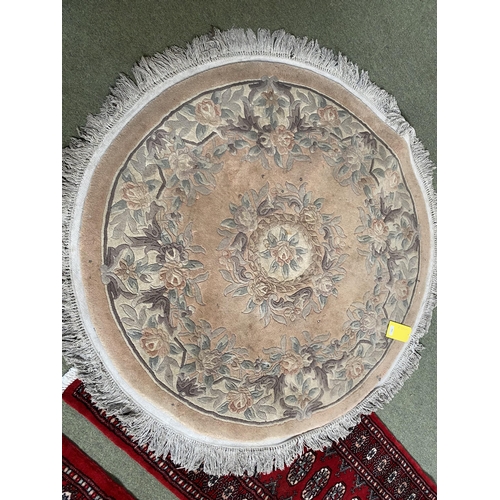 588 - Chinese wash style circular rug  with soft pink and grey floral designs 127cm diameter