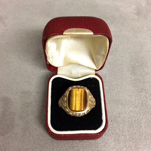 66 - A Gents 9ct gold signet ring with central tigers eye panel 6.7g, size Z