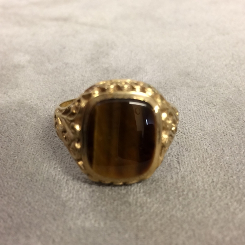 66 - A Gents 9ct gold signet ring with central tigers eye panel 6.7g, size Z