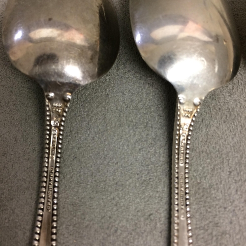 69 - six unmarked yellow metal tea spoons, 92g