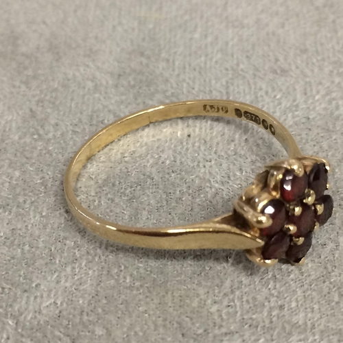 7 - 9ct gold and garnet set flower ring 1.8g, size R