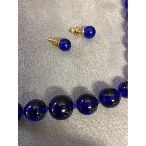 72 - Cobalt/Bristol blue graduated circular bead necklace, and matchin ear studs,  and a jet and amber st... 