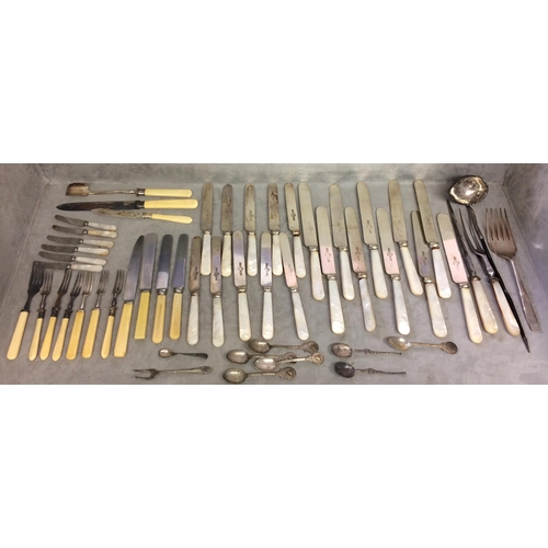 77 - A large quantity of flatware, including bone handled knives and forks etc and knife rests