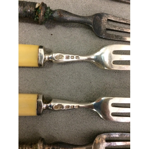 77 - A large quantity of flatware, including bone handled knives and forks etc and knife rests