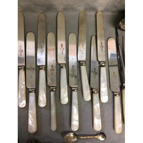 77 - A large quantity of flatware, including bone handled knives and forks etc and knife rests