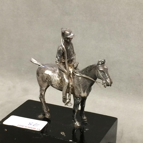 78 - Sterling silver model of a seated polo player on a polo pony,  with Sterling silver polo mallett, by... 